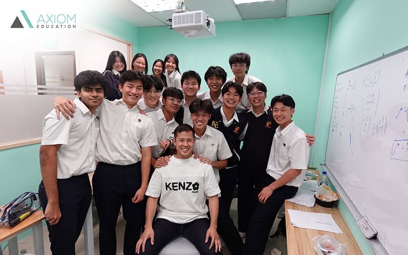 students and tuition teacher smiling in class