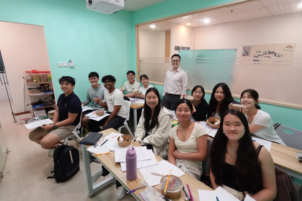 Students and teacher in a classroom at Axiom Education.